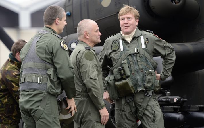 Willem-Alexander (right) talks to soldiers during a visit to Gilze Rijen airbase on November 13, 2012.
