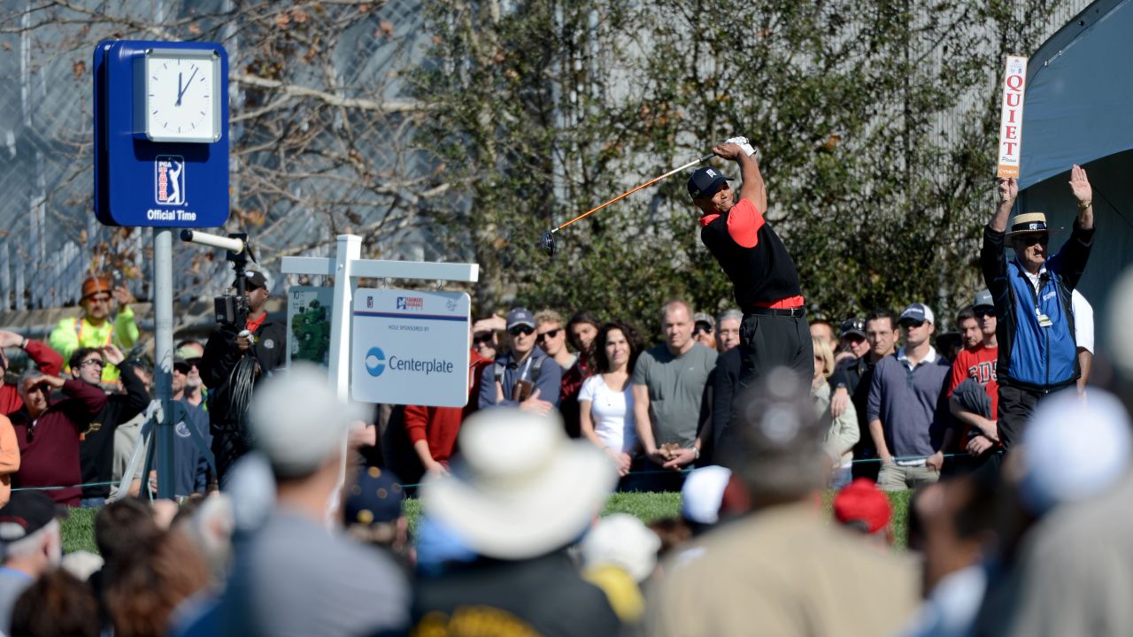 U.S. golf star Tiger Woods hits off the 10th tee during the final round at the Farmers Insurance Open on Monday.  