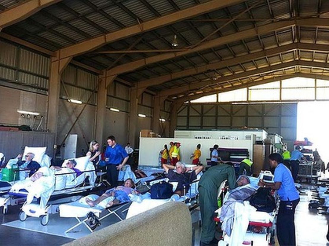 Patients from flood-hit Bundaberg hospital wait to be airlifted to safety