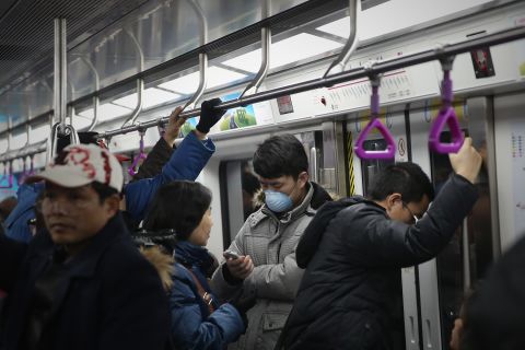 People ride the Beijing subway on January 23.