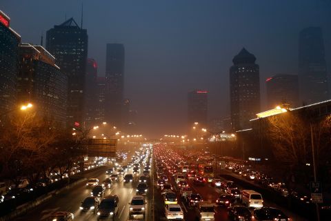 Cars travel through the smog on Wednesday, January 23, when the pollution hit serious levels.