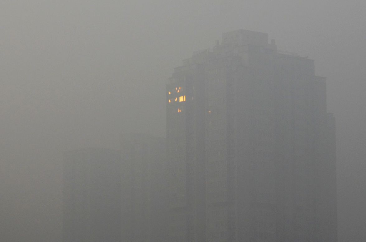 The sunlight reflects off a building in Beijing on Saturday, January 12.