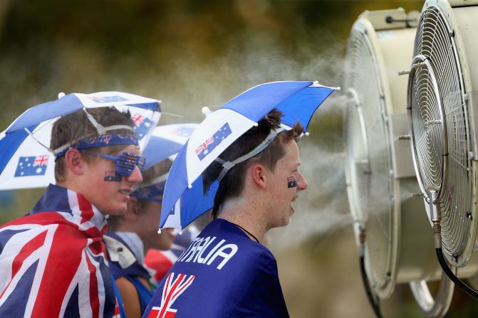 Fans take a moment to cool off as temperatures sore at the recent Australian Open.