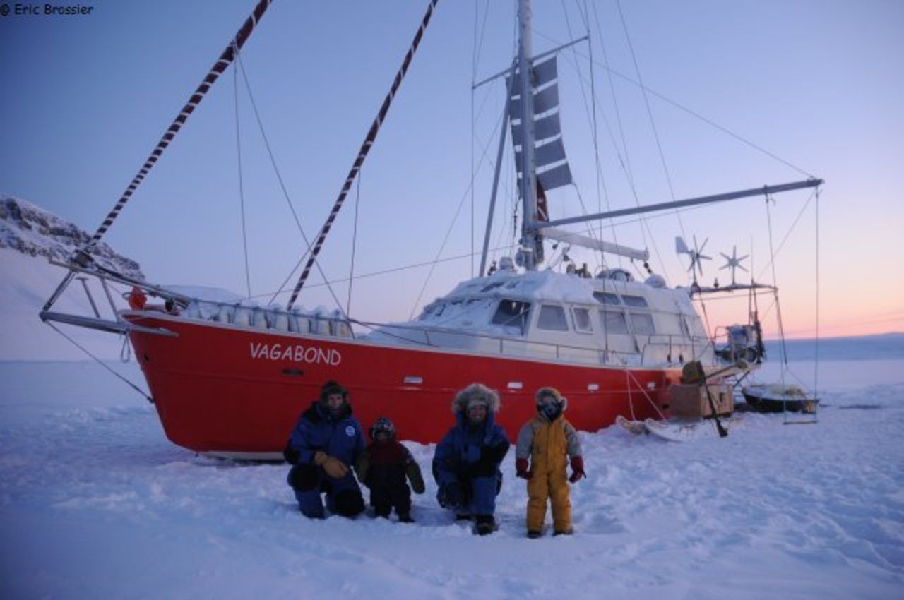 The Brossier family wrap up warm in front of their yacht, <em>Le Vagabond</em>. The family have spent the last eight winters living and carrying out research work in the northern polar regions.
