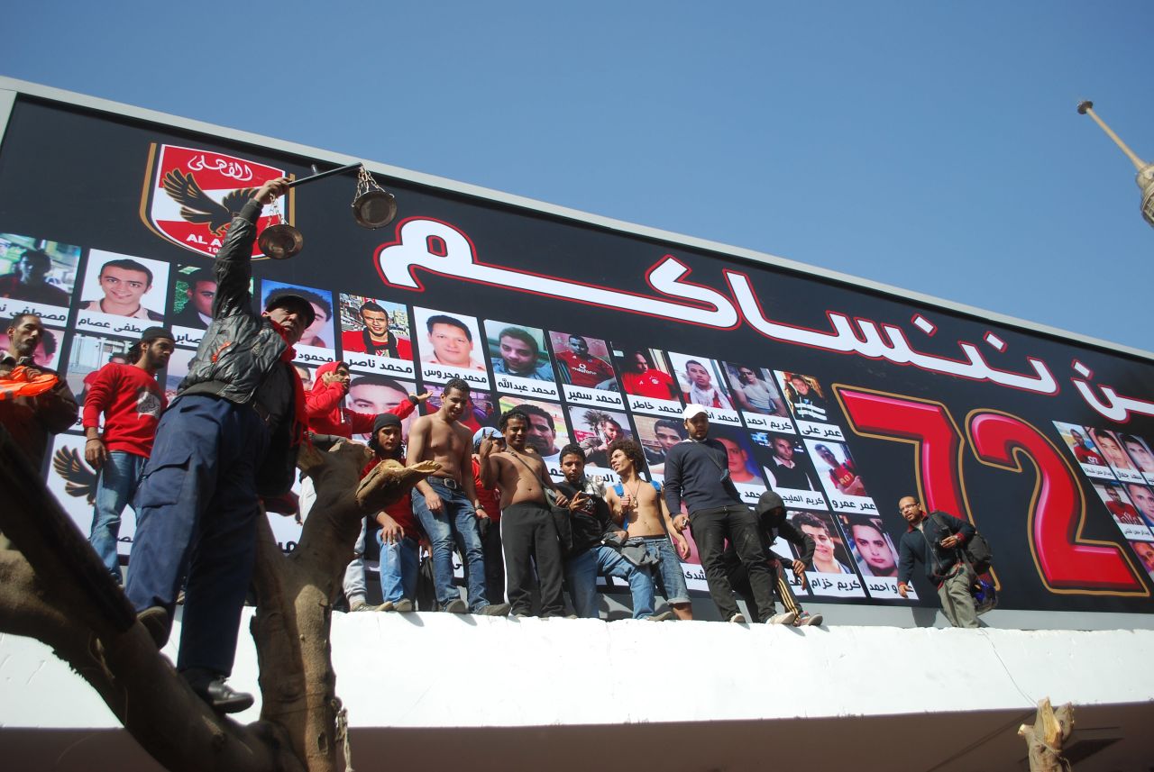 Some 15,000 fans of Al Ahly, many members of the club's Ahlawy ultras group, gathered in front of a billboard displaying pictures of the dead at the team's training ground to hear the verdict.