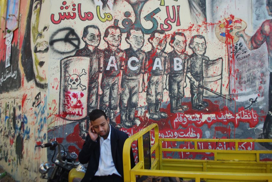 The Ahlawy played a crucial role in Egypt's two-year-old revolution. Graffiti honoring them and the dead can be seen throughout Egypt. This piece of graffiti next to Tahrir Square shows a line of police, each with the former dictator Hosni Mubarak's face. The acronym ACAB stands for "All Cops Are Bastards."