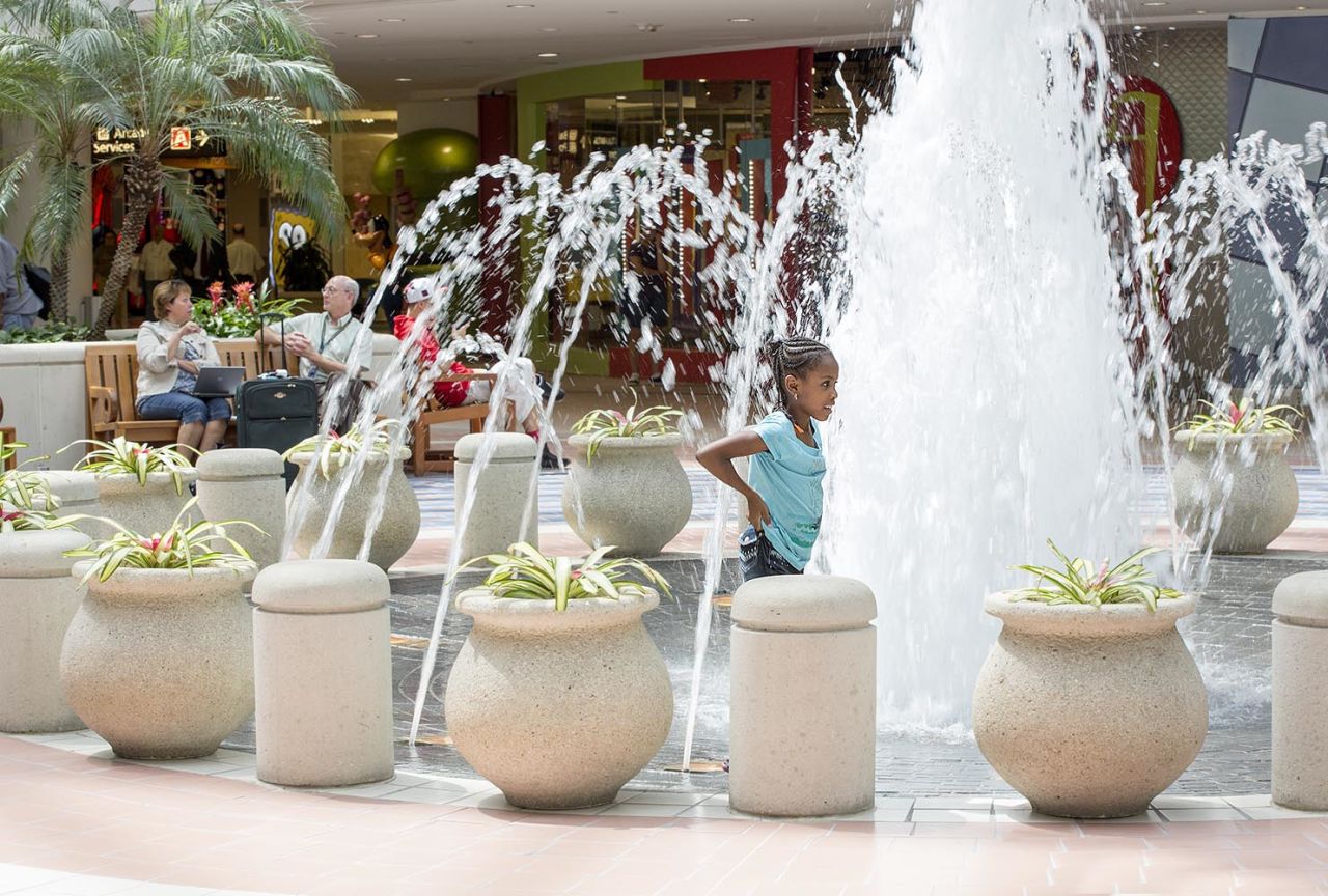 Children visiting the Orlando airport might get soaked playing in the fountain. 