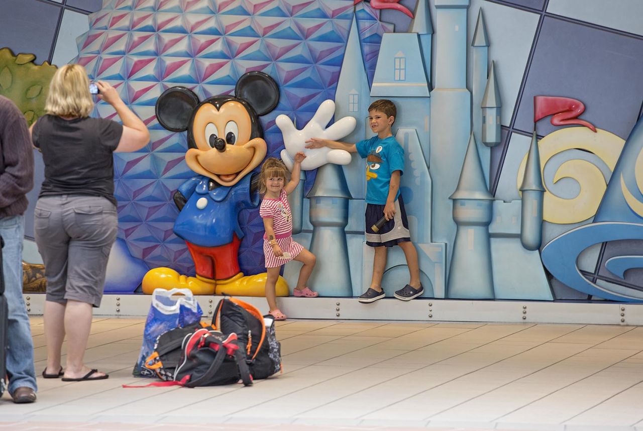 Orlando's airport ranked No. 1 for keeping kids entertained, as evidenced by Mickey Mouse's presence at the airport.