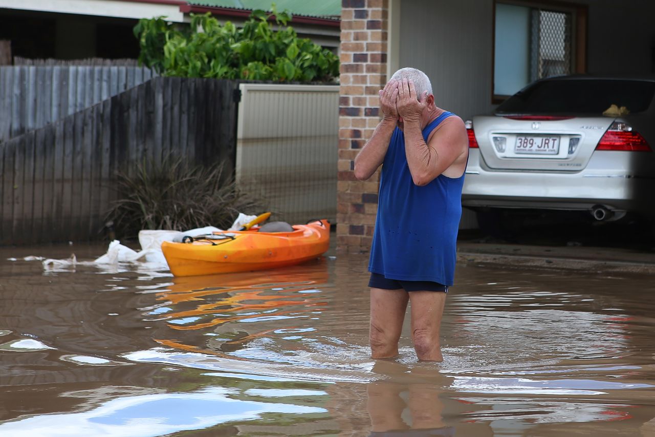 A resident reacts to the damage to his house on Wednesday, January 30, 2013 in Bundaberg, Australia. Parts of southern Queensland experienced record flooding from torrential rains. Floodwaters began receding overnight.