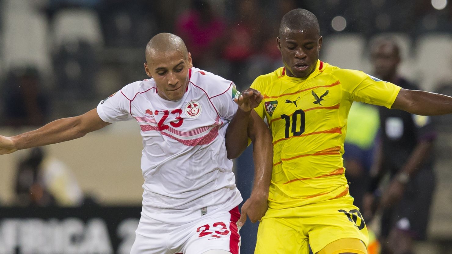 Wahbi Khazri of Tunisia and Floyd Ama Ayite of Togo do battle during the Africa Cup of Nations clash in Nelspruit.