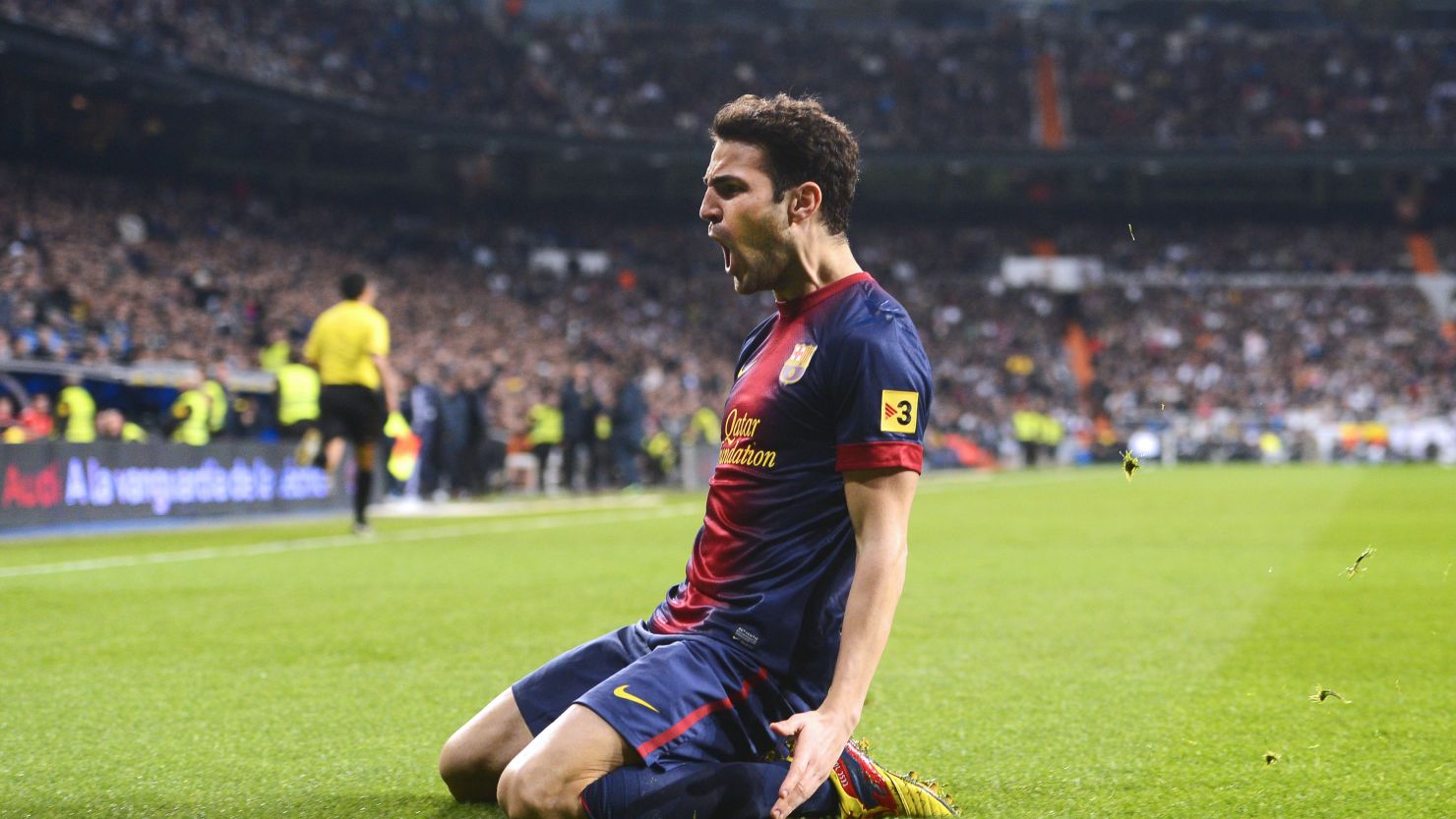 Barcelona's Cesc Fabregas celebrates after giving his side the lead at the Santiago Bernabeu.