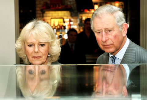 Britain's Prince Charles, Prince of Wales, and his wife Camilla, Duchess of Cornwall, study a model of the refurbished King's Cross train station during an event to mark 150 years of the London Underground. Charles is next in line to the British throne.