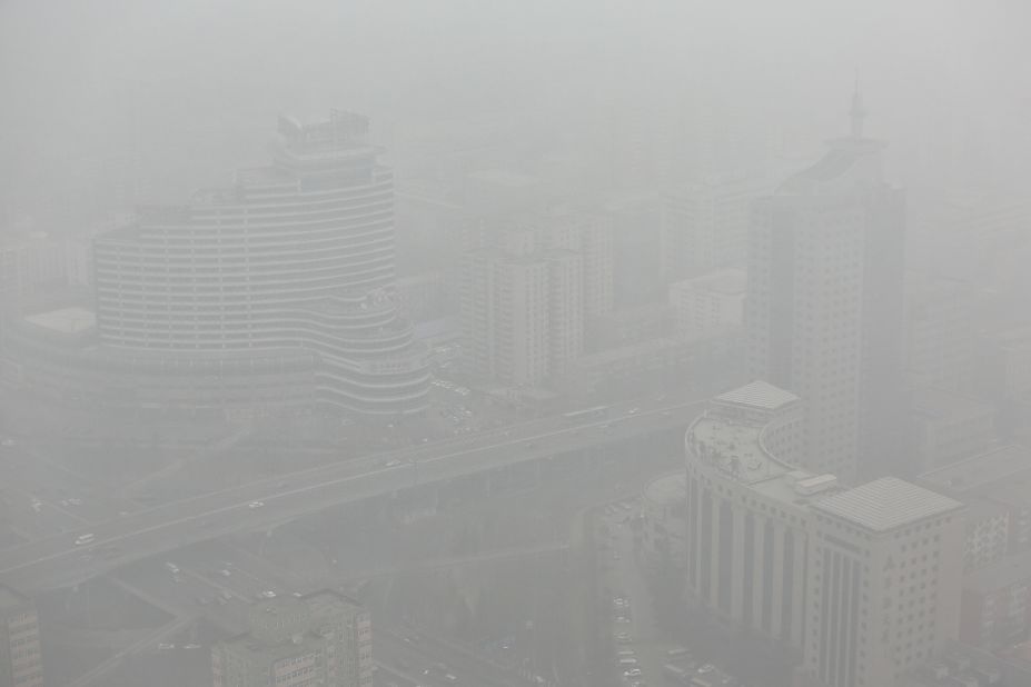 Skyscrapers in Beijing can be seen through severe smog on January 30.