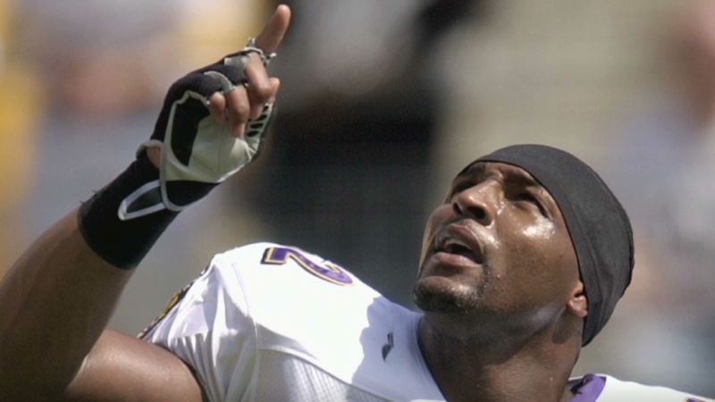 former Baltimore Ravens linebacker Ray Lewis Jr., left, smiles as