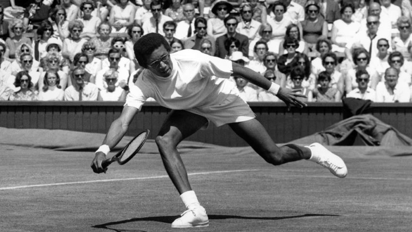 American tennis star Arthur Ashe in action against El Shafei on the centre court at Wimbledon during the men's singles.