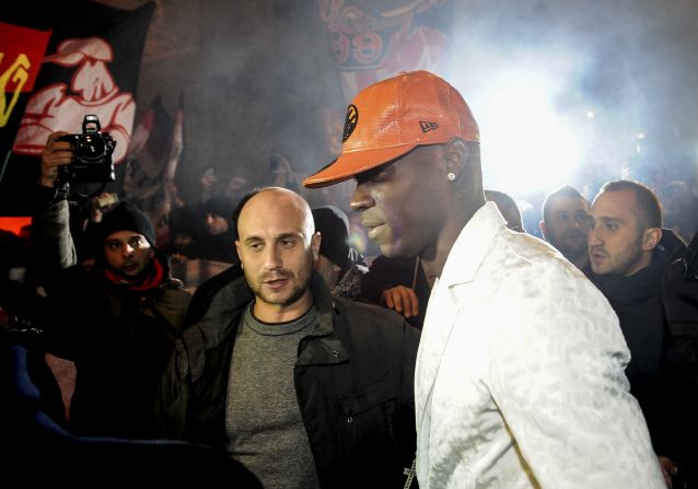 Mario Balotelli was mobbed by fans outside a restaurant as he returned home to Italy to complete his $30 million move from AC Milan to Manchester City.