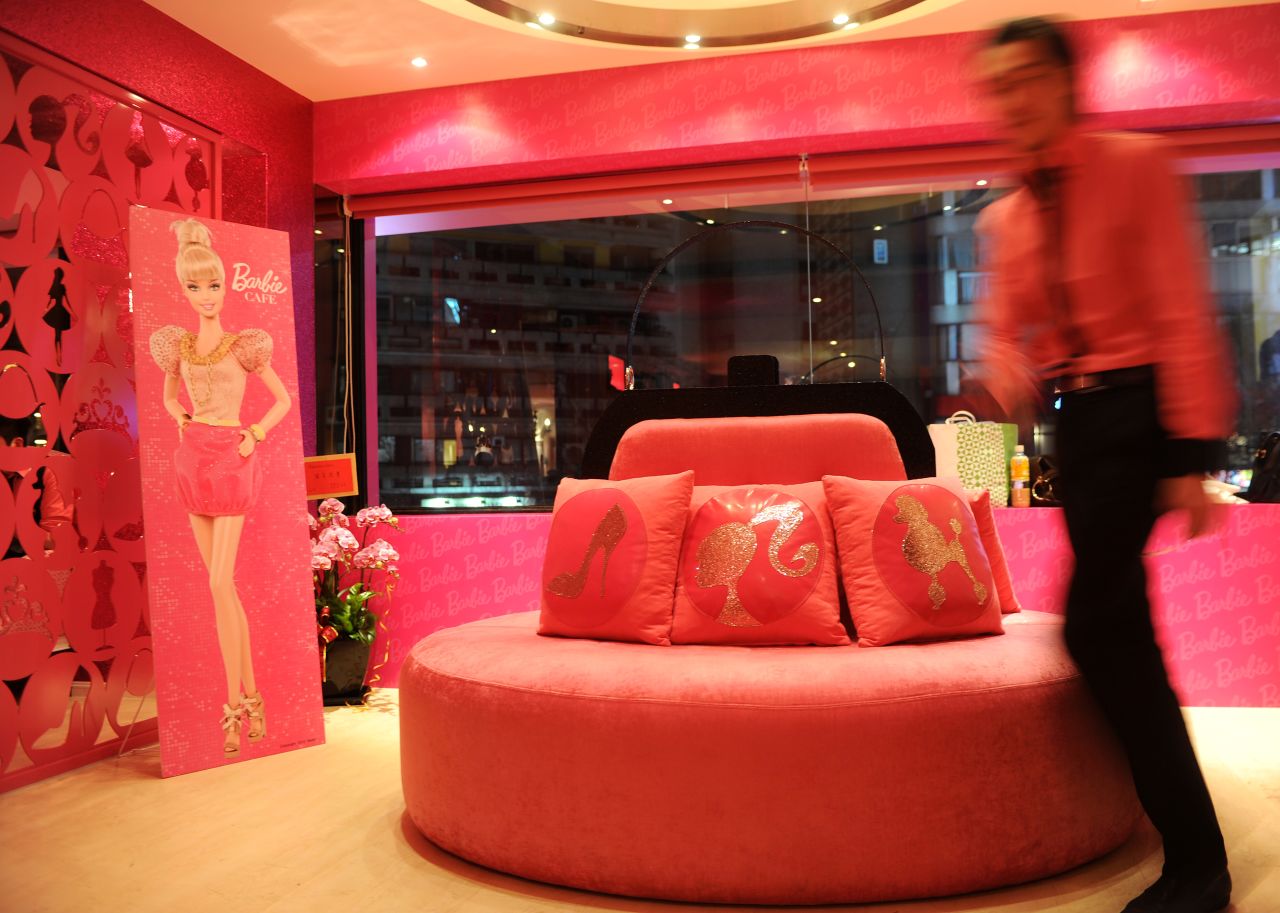 The entrance of Barbie Café, featuring a purse-like sofa. More beauty salon than restaurant.