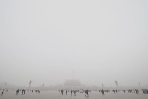 Tourists visit Beijing's Tian'anmen Square during record air pollution in January 2013. The haze that choked many Chinese cities during this time covered 1.43 million square kilometers, said China's Ministry of Environmental Protection. 