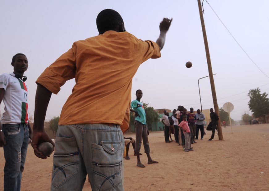 Men play boules, a game that was forbidden under Islamist rule. on January Wednesday, 30, in Gao, Mali.  Gao, once a key Islamist stronghold, was retaken on January 26 by French and Malian troops.