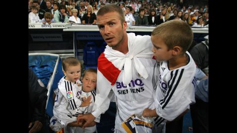 The midfielder celebrates with his sons in 2007 after Real Madrid won the Spanish League title by beating Mallorca.