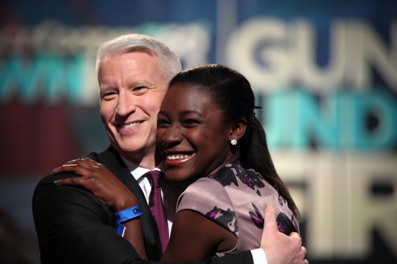 Anderson Cooper embraces a member of the audience at the town hall special.