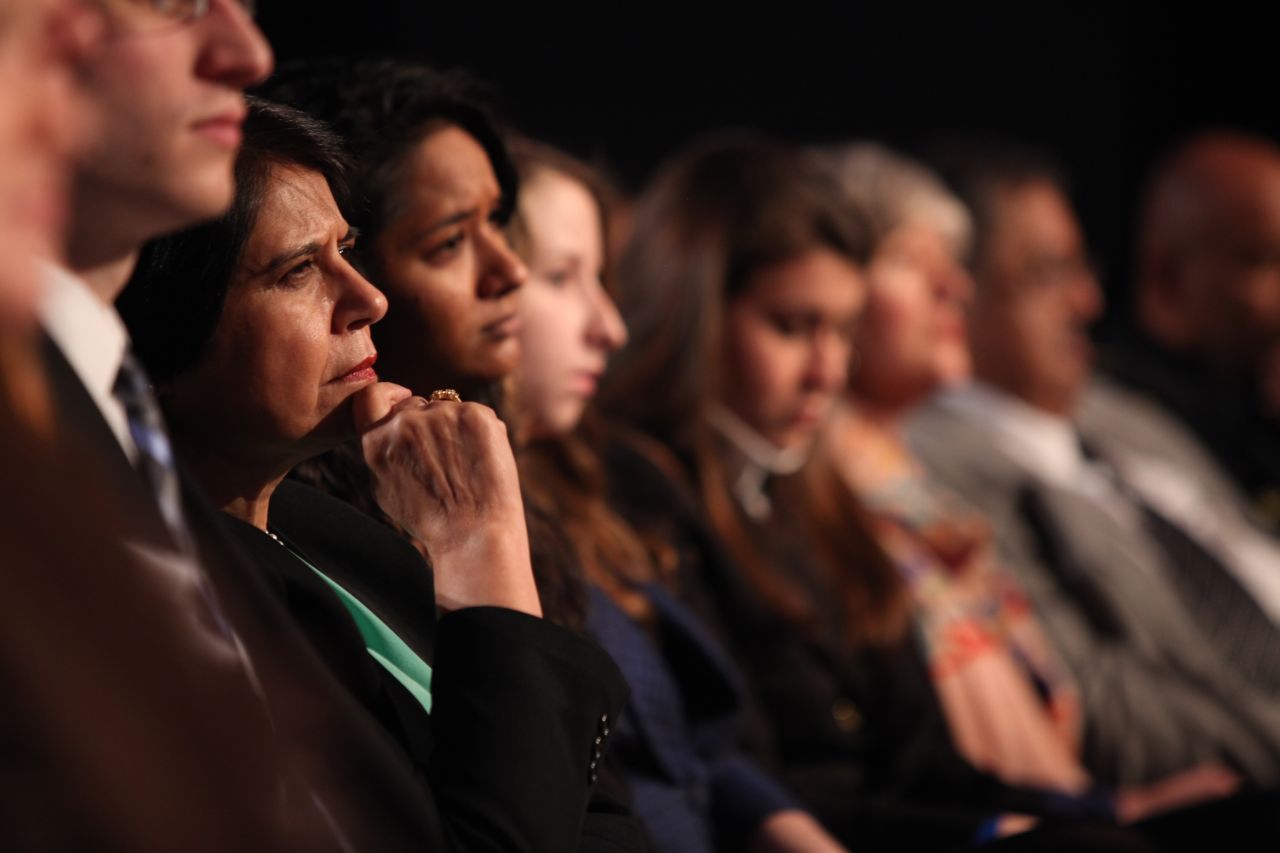 Audience members listen to panelists.