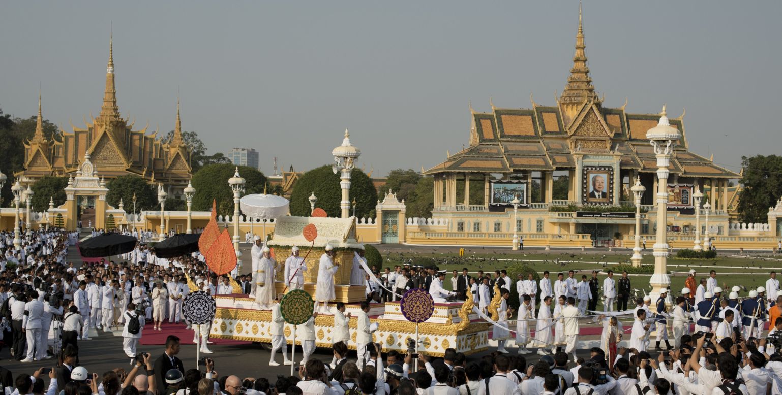 The coffin of the late former King Norodom Sihanouk is seen during his funeral procession in front of the Royal Palace on Friday. 