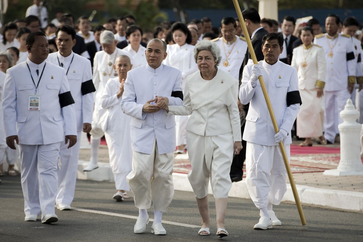 Sihanouk's widow Queen Monique (Center-R) and King Norodom Sihamoni (Center-L) walk through the funeral procession on Friday.