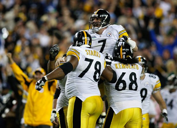 The Pittsburgh Steelers hold the record for most wins, taking the championship six times. Steelers quarterback Ben Roethlisberger celebrates with his teammates after throwing a fourth quarter touchdown against the Arizona Cardinals during Super Bowl XLIII.