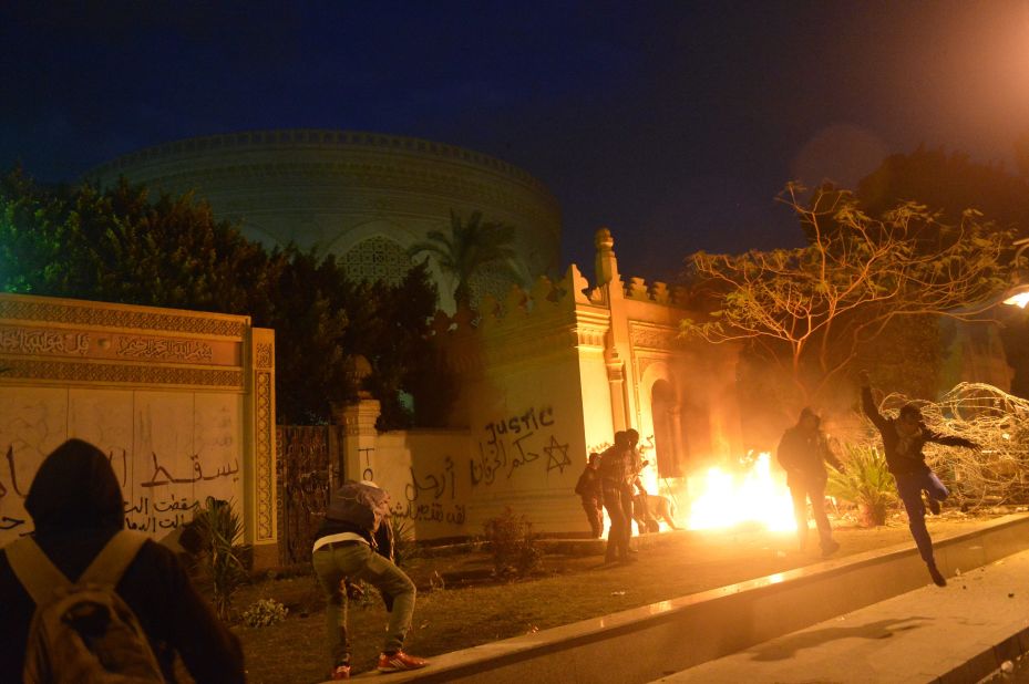 The entrance of Egypt's presidential palace in Cairo is in flames February 1, as protesters battle security forces.