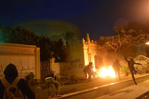 The entrance of Egypt's presidential palace in Cairo is in flames February 1, as protesters battle security forces.
