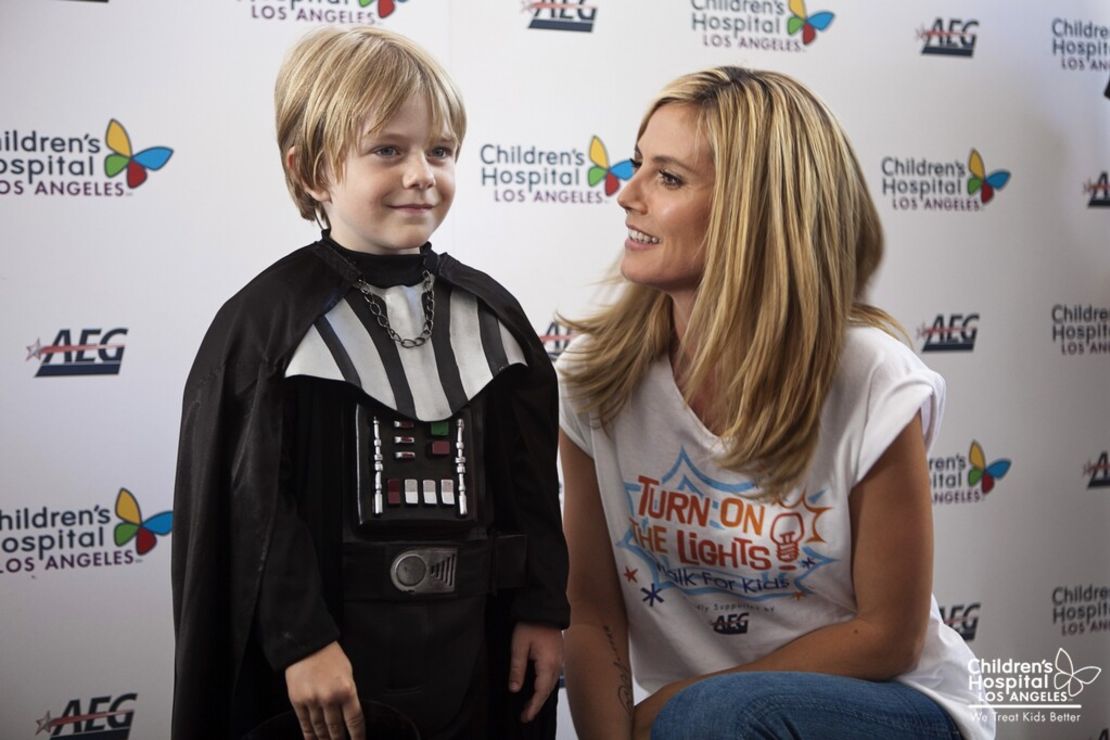 The actor appears with Heidi Klum before a charity event.