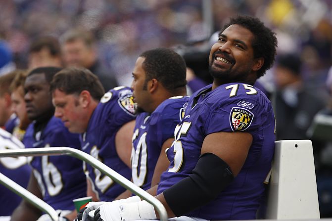 Jonathan Ogden of the Baltimore Ravens smiles from the bench during a 2007 game against the Cleveland Browns in Baltimore. Ogden is among this year's Hall of Fame inductees.