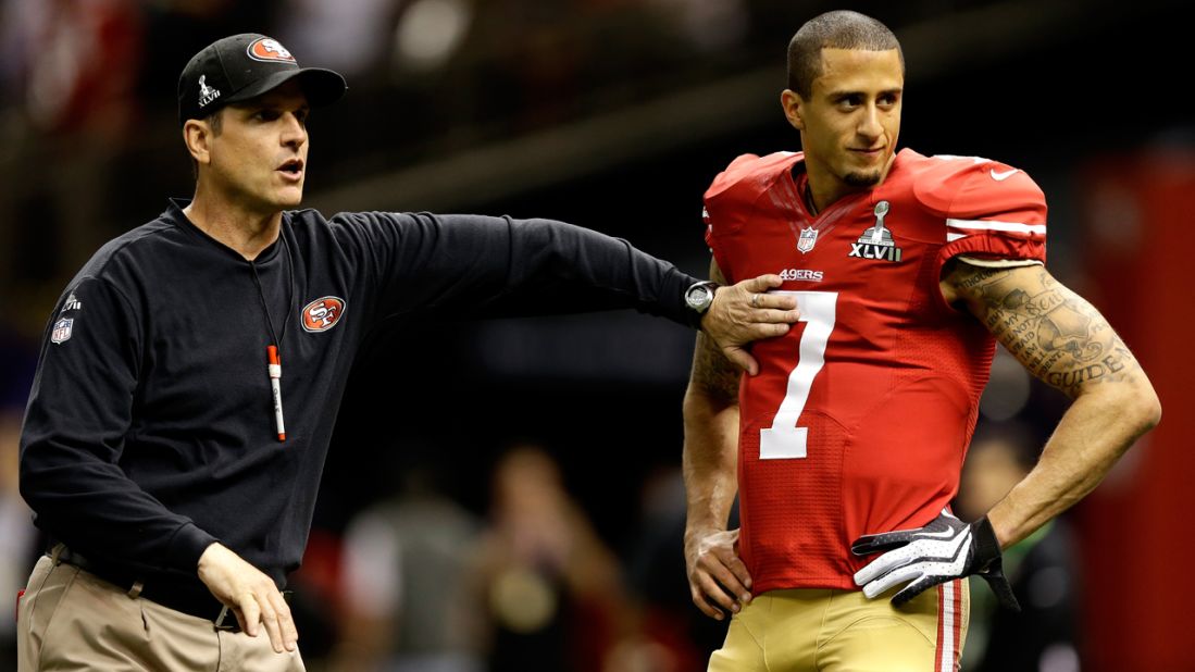 Head coach Jim Harbaugh works with quarterback Colin Kaepernick of the San Francisco 49ers during warm-ups prior to the game.