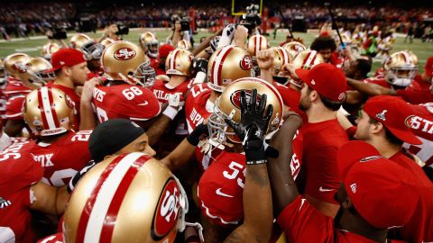 The 49ers huddle up prior to the start of the game.