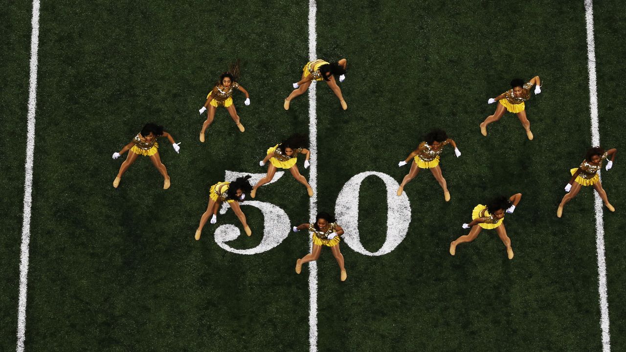 Dancers perform on the field before the start of Super Bowl XLVII.