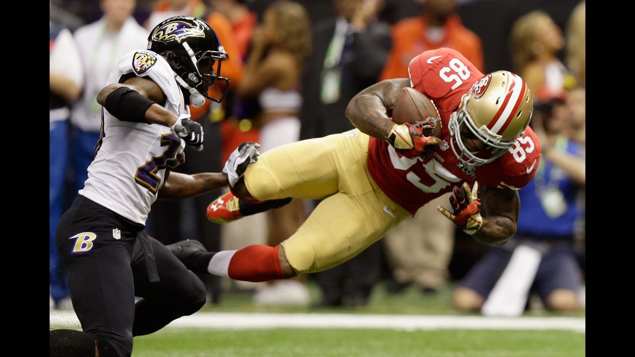 Vernon Davis of the San Francisco 49ers goes airborne after catching a pass against the Baltimore Ravens in the first quarter of Super Bowl XLVII at the Mercedes-Benz Superdome in New Orleans, Louisiana, on Sunday, February 3.
