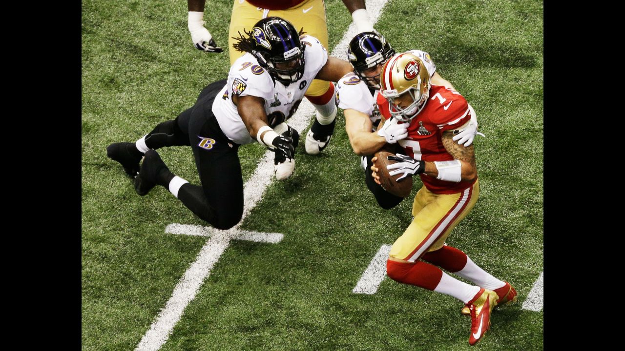 Paul Kruger of the Baltimore Ravens sacks 49ers quarterback Colin Kaepernick.