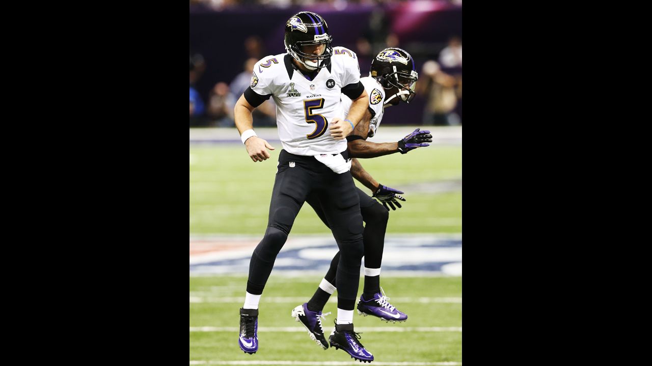 Joe Flacco, left, and Jacoby Jones of the Baltimore Ravens celebrate after Flacco threw a 1-yard touchdown pass to Dennis Pitta.