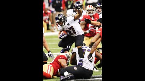 Ray Rice of the Baltimore Ravens runs the ball against the 49ers.