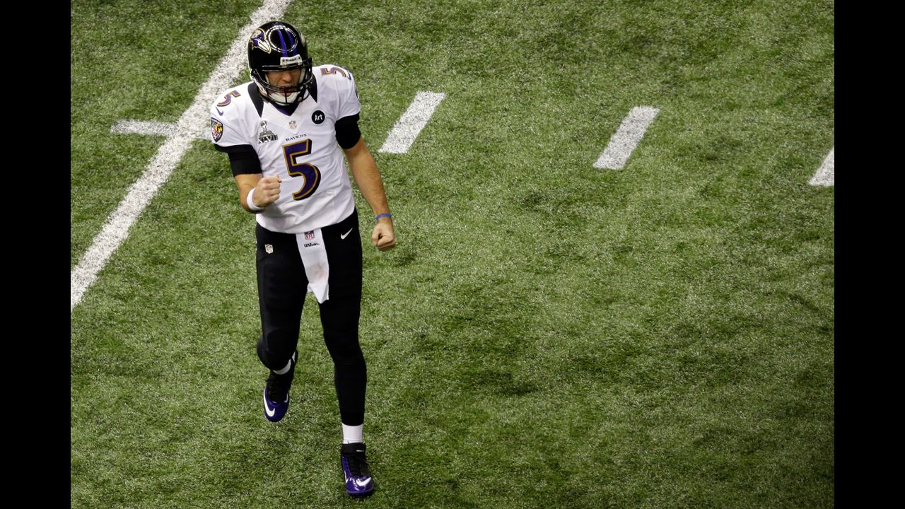 Ravens quarterback Joe Flacco celebrates after throwing a 1-yard touchdown pass to Dennis Pitta.
