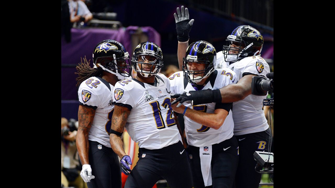 From left, Torrey Smith, Jacoby Jones, Joe Flacco and Kelechi Osemele of the Baltimore Ravens celebrate after Jones scored on a 56-yard touchdown pass from Flacco.