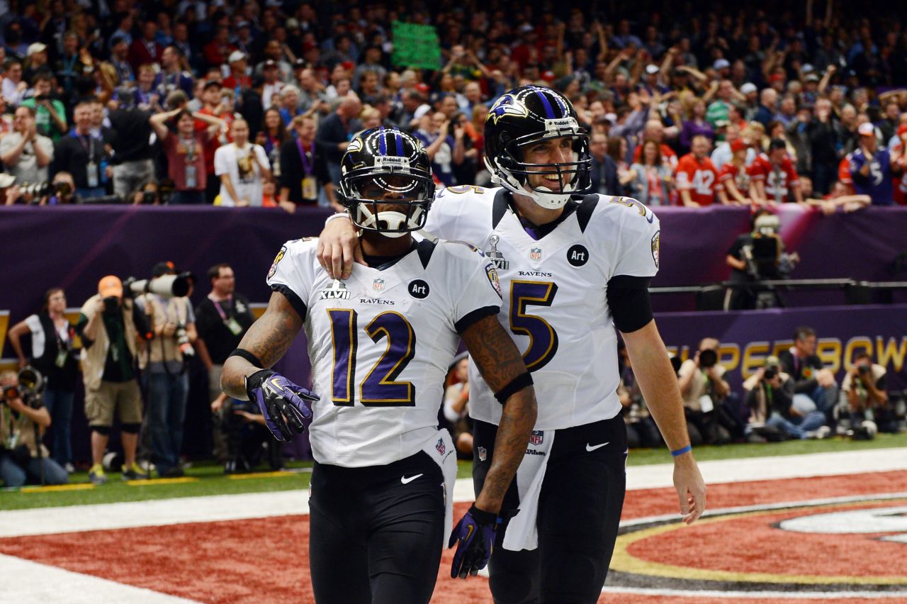 Jacoby Jones, left, and Joe Flacco of the Baltimore Ravens celebrate after their second-quarter touchdown.