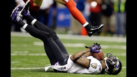 Jacoby Jones of the Ravens catches a 56-yard pass. He would get up and score.