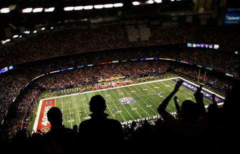 Fans cheer in the cavernouse Mercedes-Benz Superdome in New Orleans during Super Bowl XLVII.