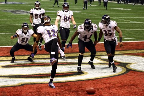 Jacoby Jones of the Baltimore Ravens, No. 12, does "the Ray Lewis dance" to celebrate his 108-yard kickoff return for a touchdown at the start of the third quarter.