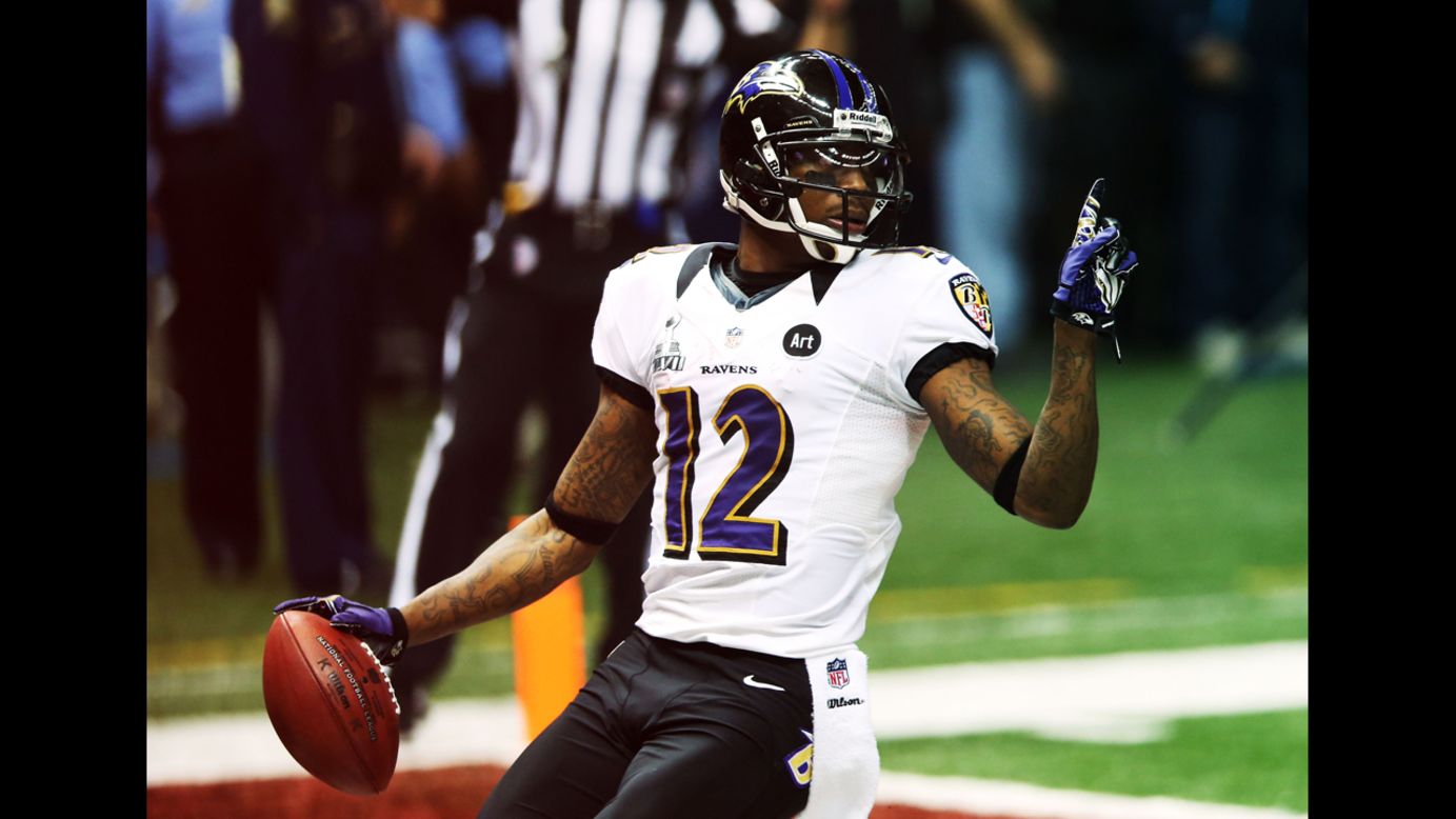 Ravens kick returner Jacoby Jones celebrates his touchdown at the start of the second half.