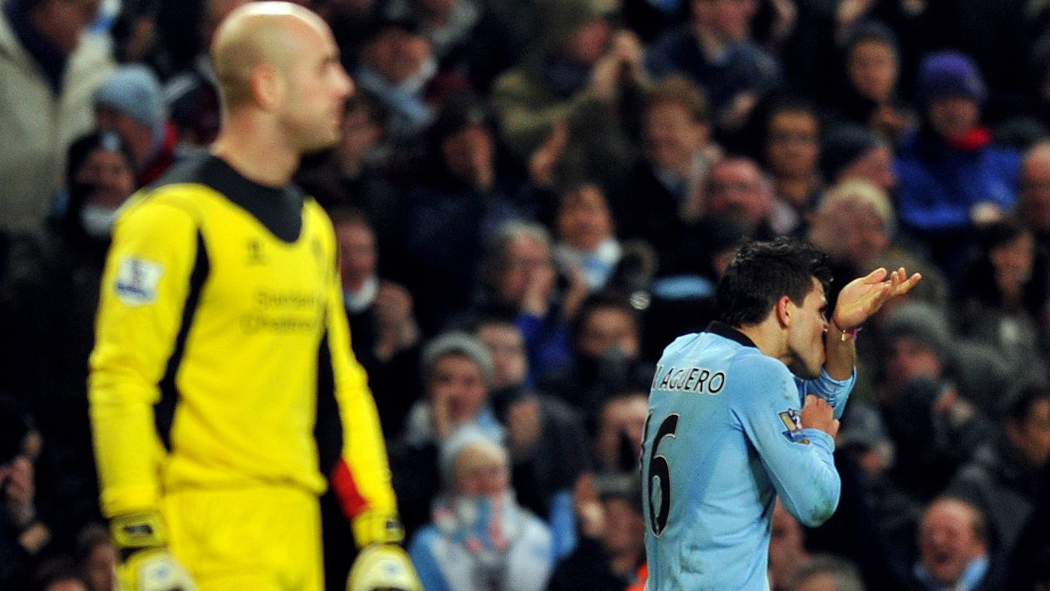 Manchester City's Argentina striker Sergio Aguero (right) celebrates scoring the equalizer at home to Liverpool on Sunday. 