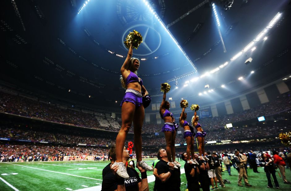 The Ravens' cheerleaders perform on the sidelines during the power outage.