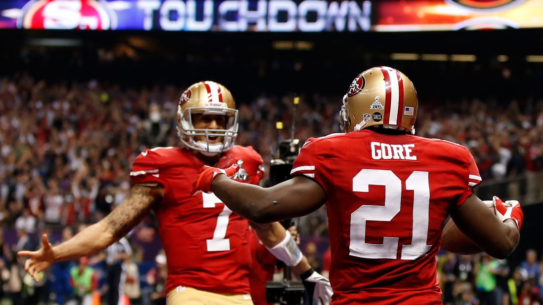 Running back Frank Gore of the San Francisco 49ers celebrates with quarterback Colin Kaepernick after scoring a touchdown in the third quarter.
